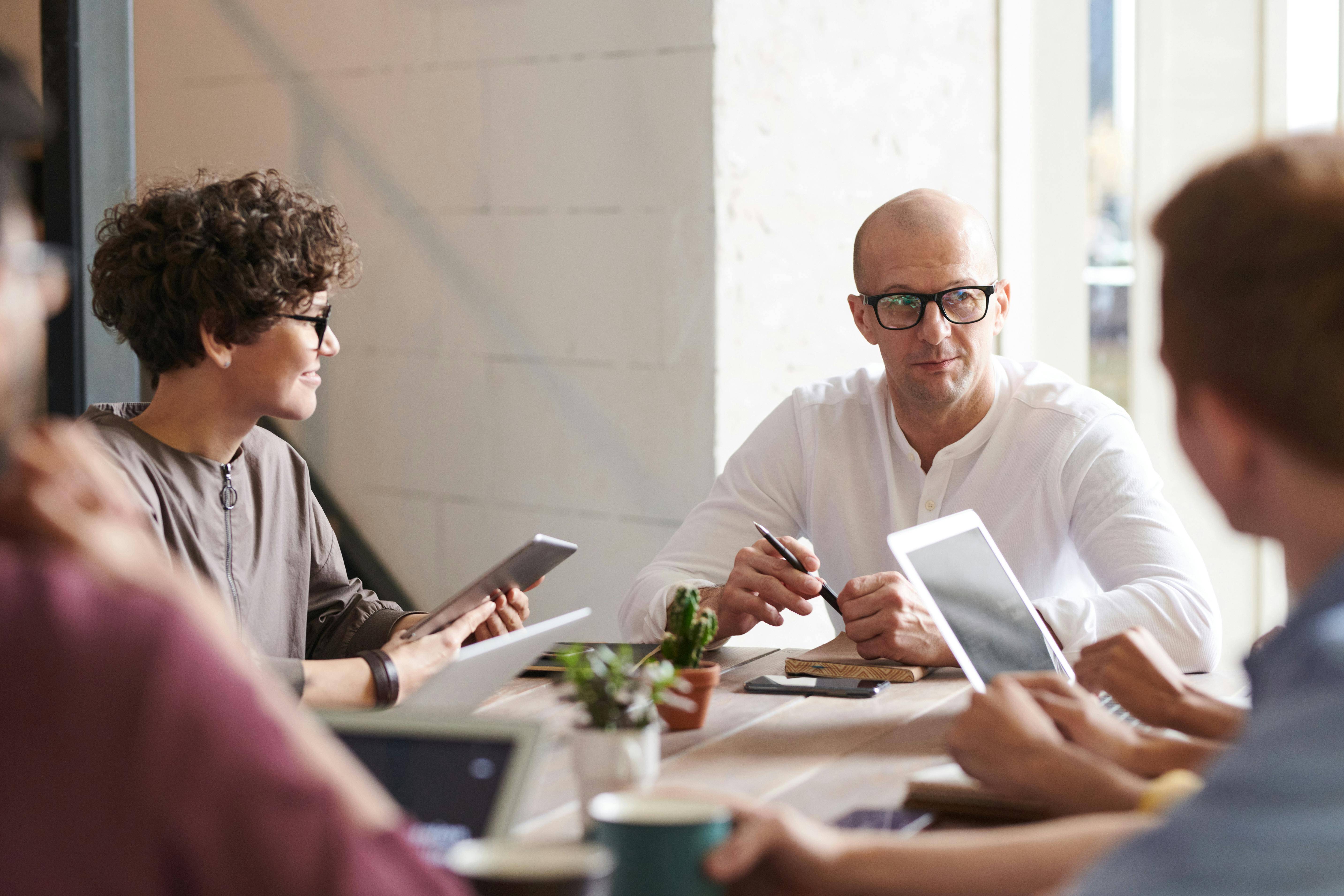 Legal team sat around a meeting desk