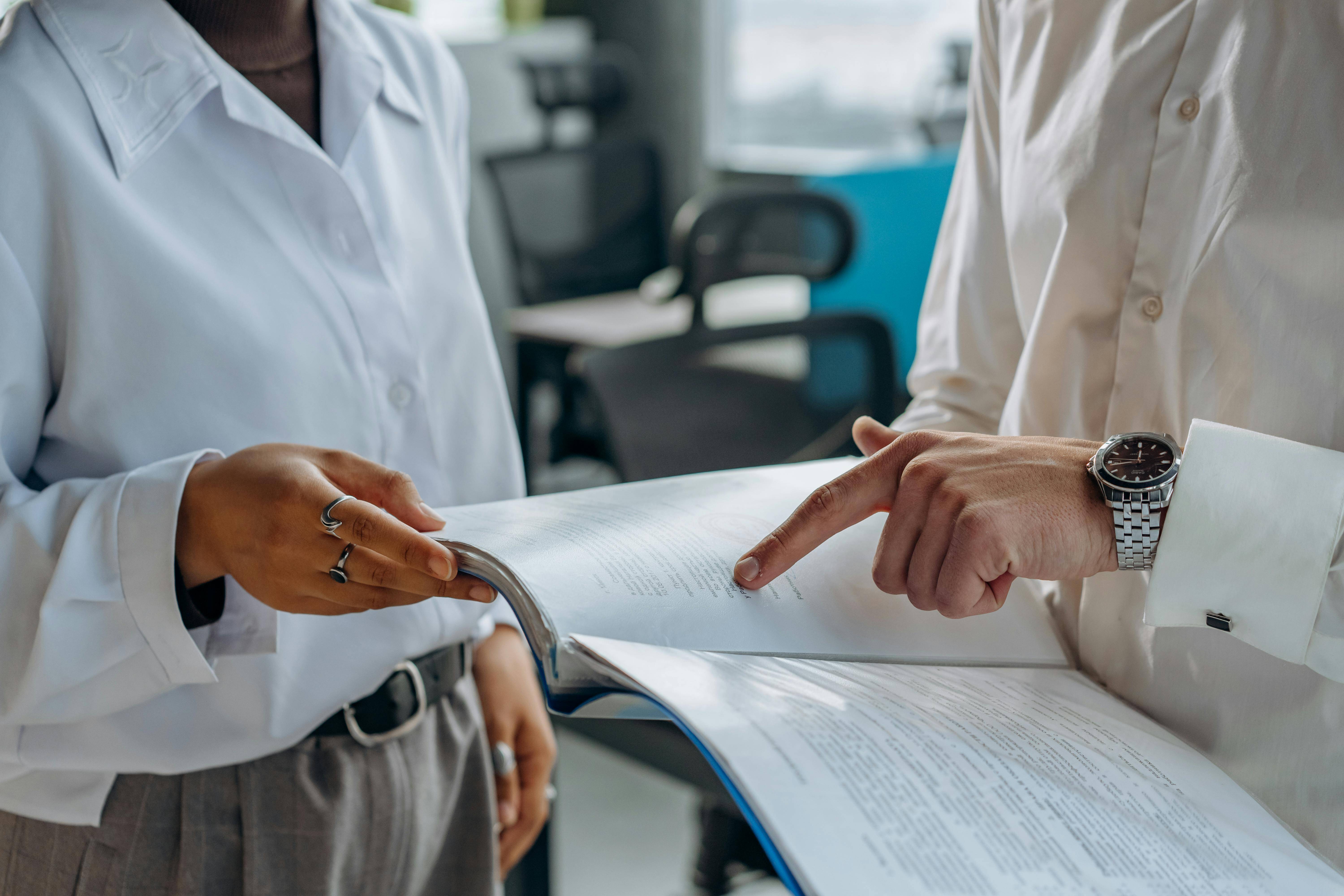 Two people looking at documents