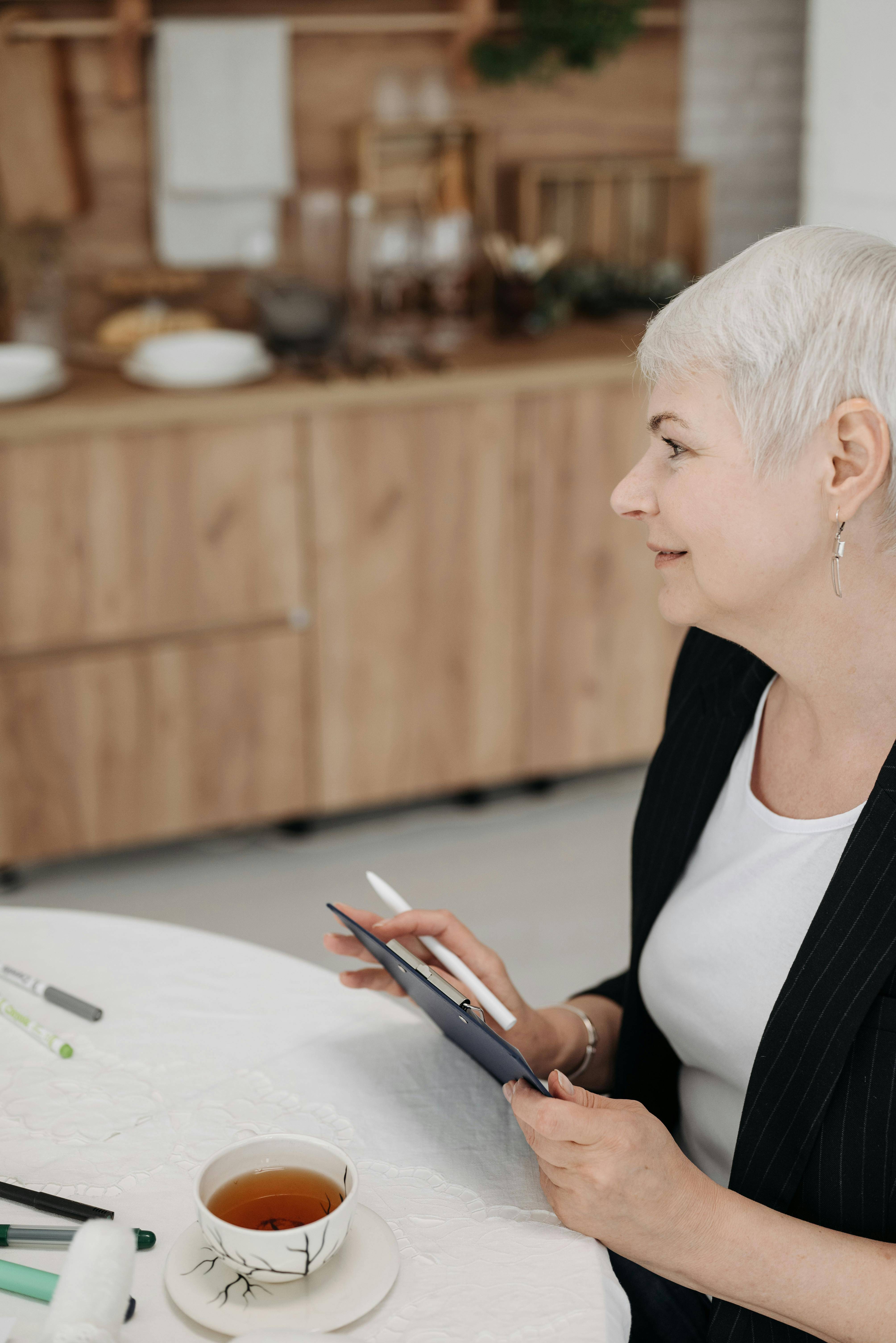 Woman sat with an ipad