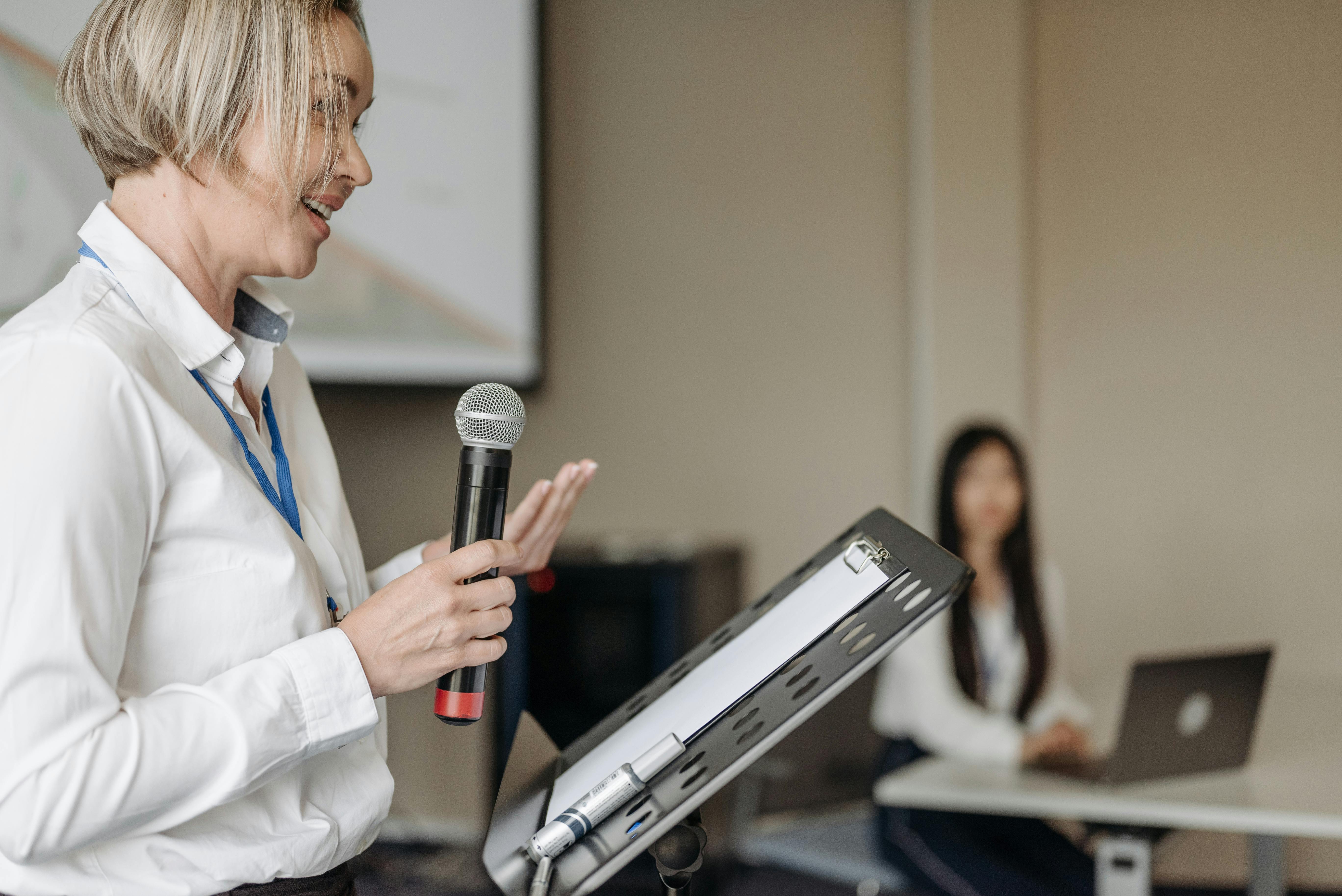 Woman giving a talk with a microphone 